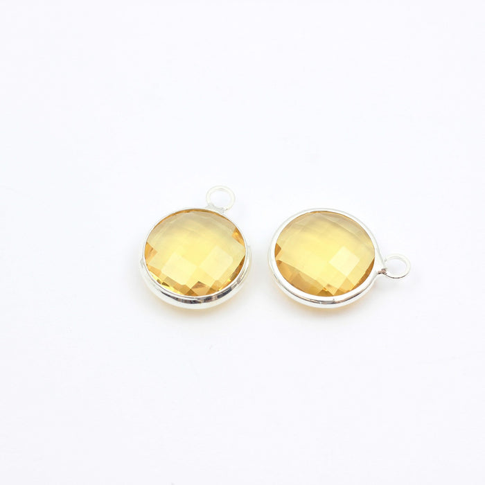 Vente pendentif perle en verre à facettes jaune 16x13mm avec contours argentés